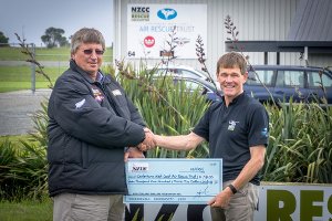 Ken Mears presenting Canterbury West Coast Air Rescue Trust with proceeds from the DRILL2015 Charity Auction